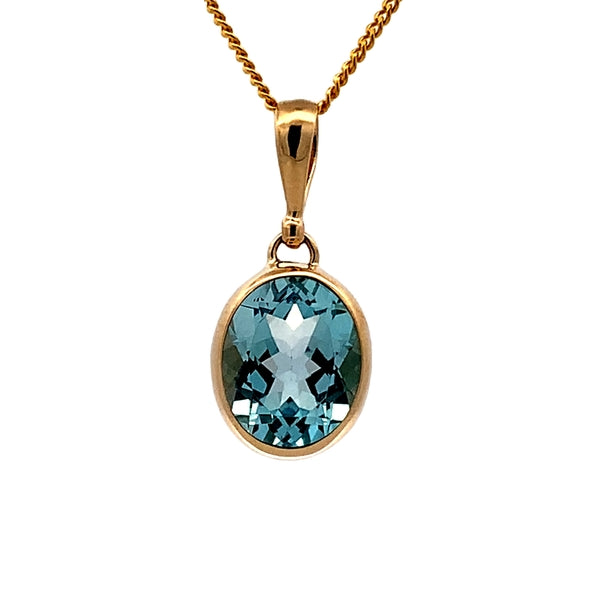 9ct Yellow Gold 11x9mm Oval Bezel Set Blue Topaz Pendant
